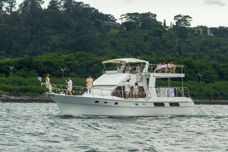 White yacht cruising turquoise water