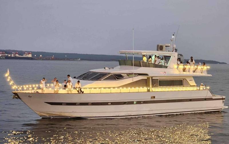 Yacht illuminated at dusk