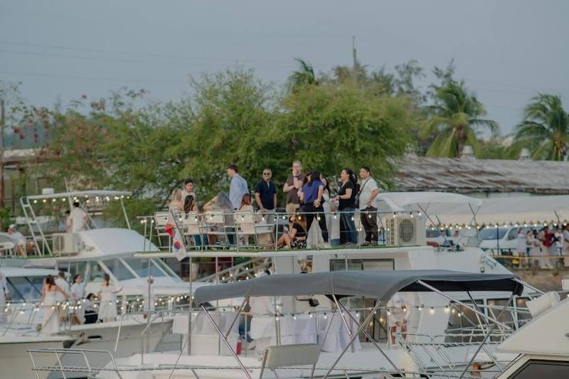 Guests dining on deck at the dock
