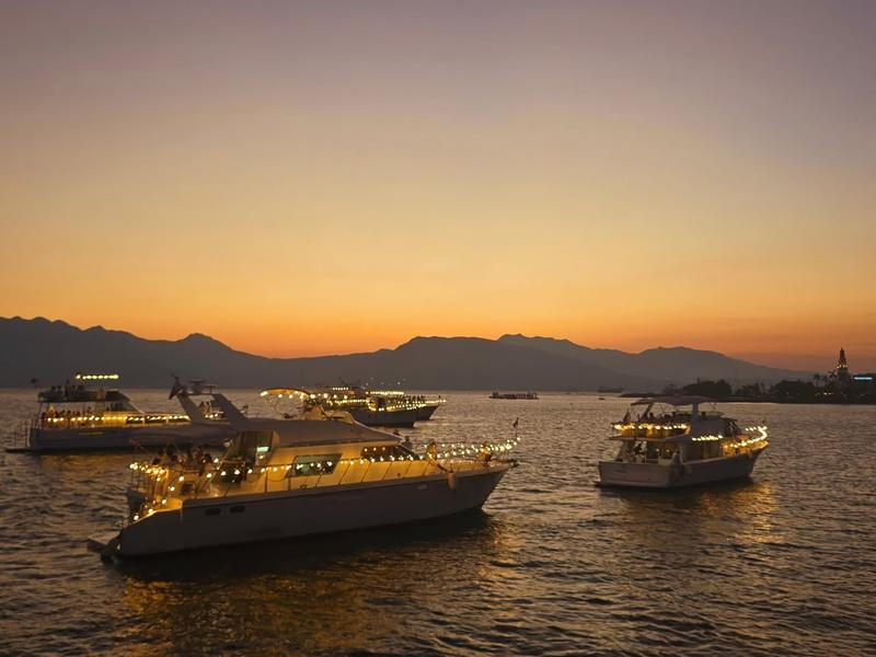 Yachts lit on Manila Bay at sunset