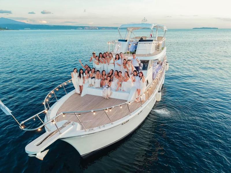 Group on the bow of a yacht